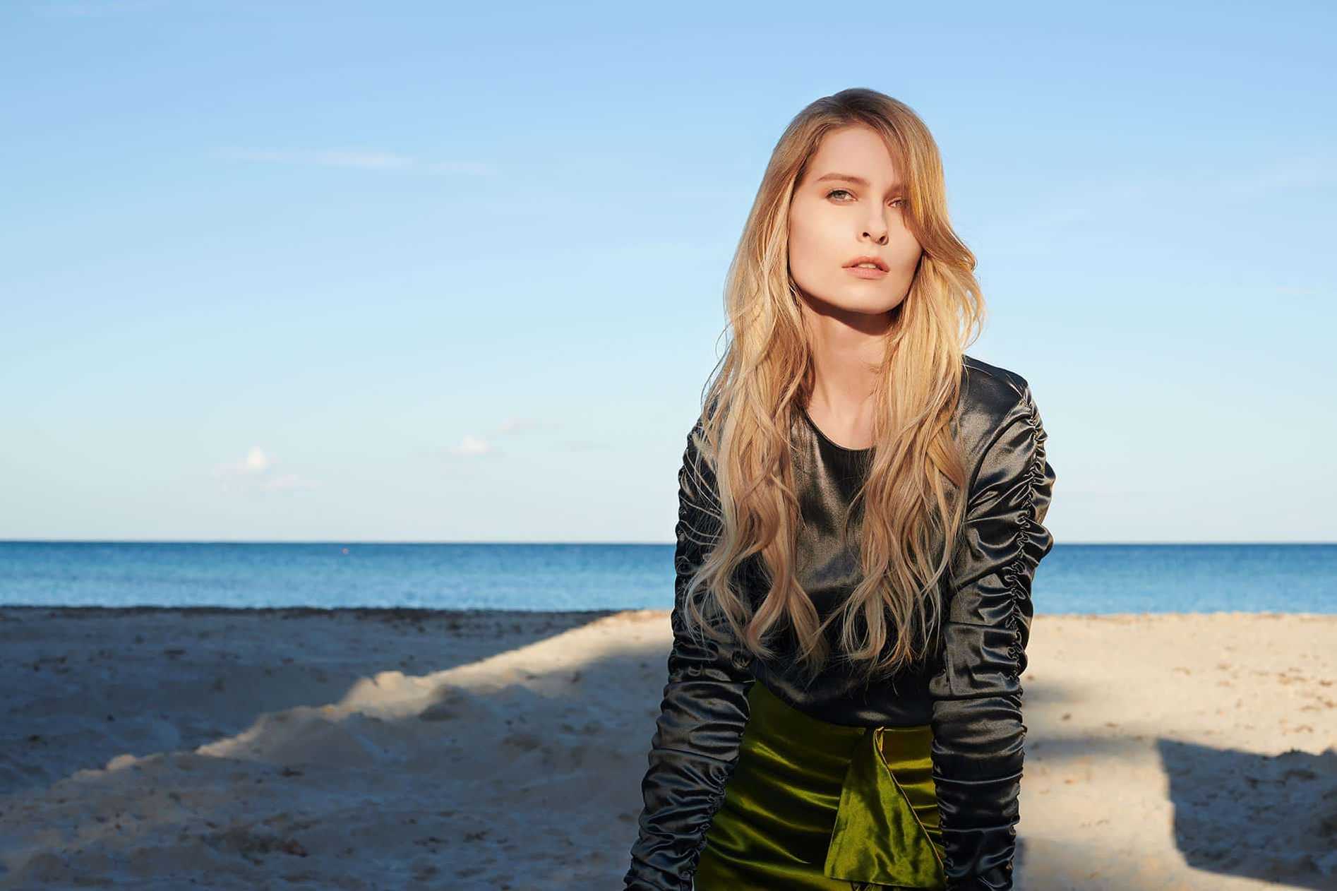 Girl at the seaside with hair extensions